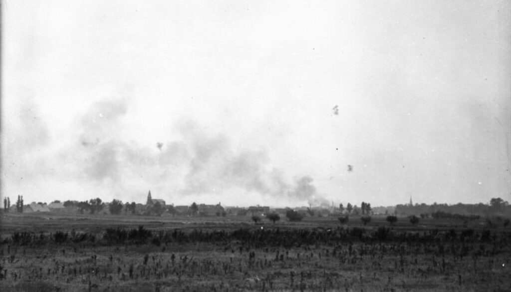 174_German incendiary shells bursting in village captured by Canadians. Advance East of Arras. September, 1918